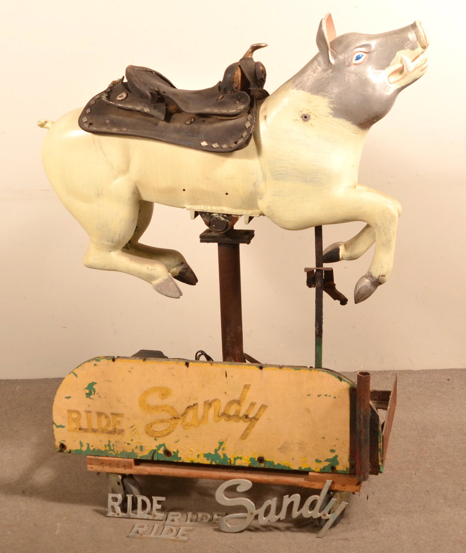 Vintage Child's Mechanical Sandy the Pig Ride.: Vintage Child's Mechanical Sandy the Pig Ride. Cast alloy with electric motor. Leather saddle is not original. 47"h. x 43-1/2"l. Condition: Fair, working.