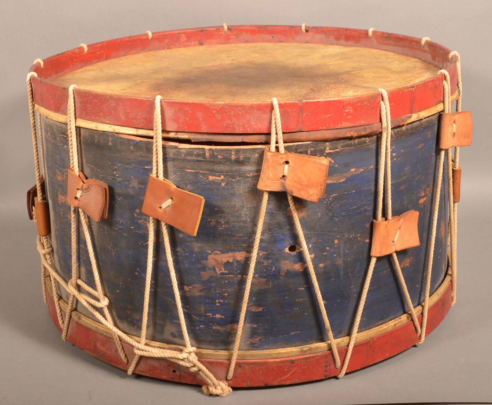 Antique Red, White and Blue Painted Snare Drum.: Antique Red, White and Blue-Painted Snare Drum. Unmarked. 15"h. x 27" diam. Condition: Good with wear.