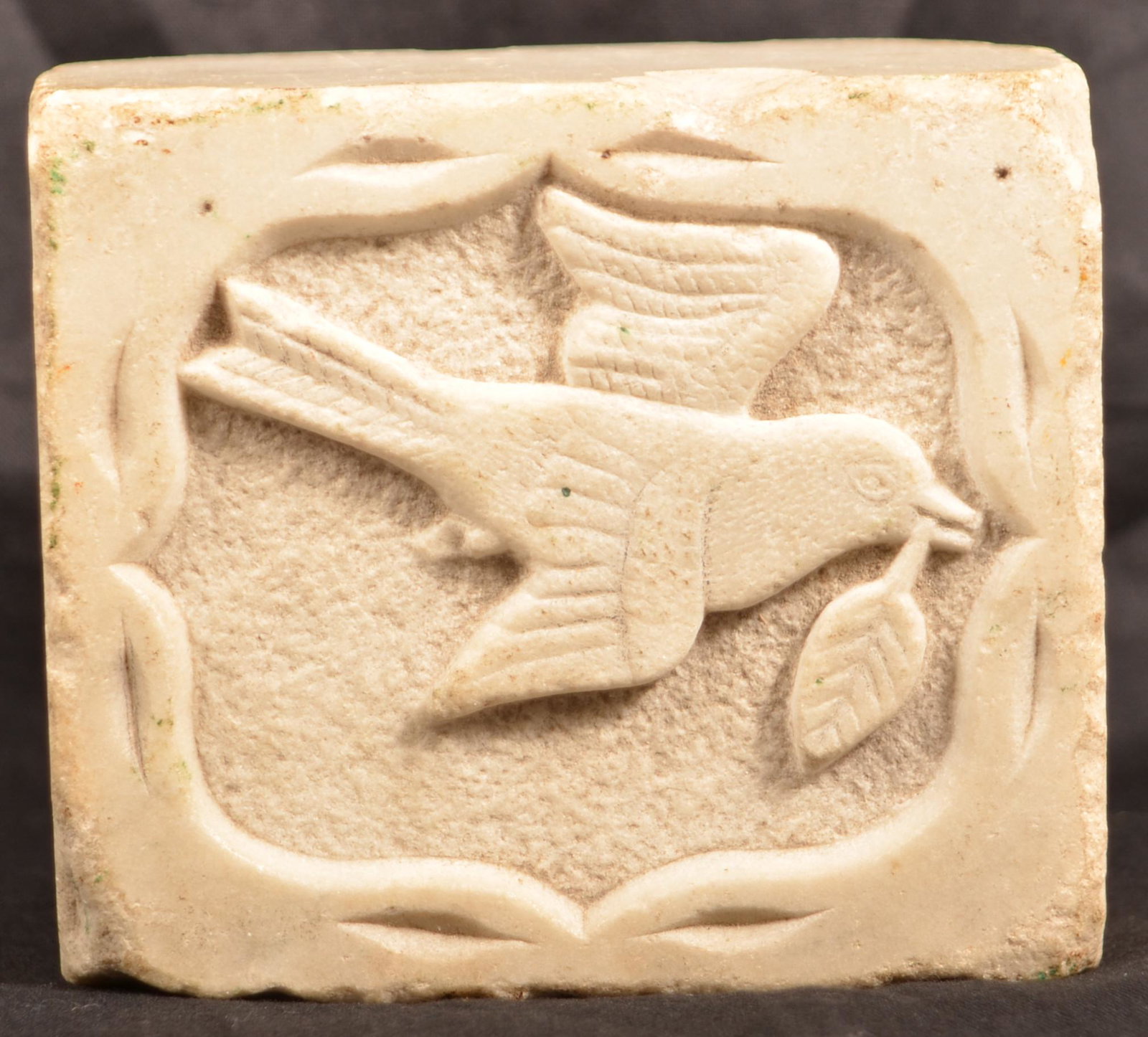 Pennsylvania 19th Century Carved Marble Doorstop.: Pennsylvania 19th Century Carved Marble Doorstop. Relief carved with flying bird on top, tulip and foliate motifs on sides and initialed "O.D.B." on front panel. Eugene and the late Vera Charles colle