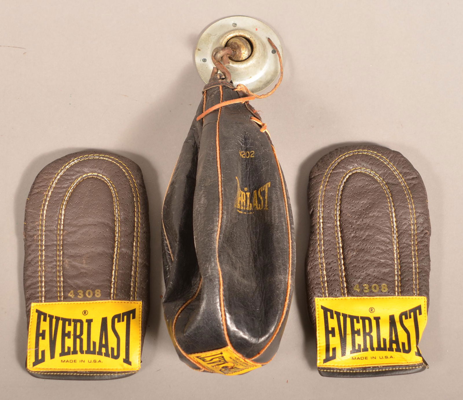 Vintage Leather Everlast Speed Bag and Boxing Gloves.: Vintage Leather Everlast Speed Bag and Boxing Gloves. Gloves 9-1/4". Condition: Very good with minor wear.