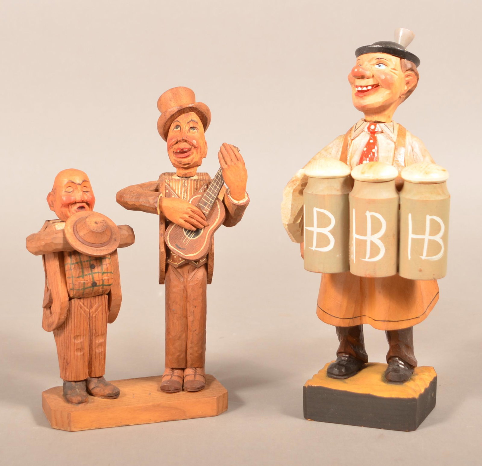 Two Vintage Hand-Carved Wood Bar Sets.: Two Vintage Hand-Carved Wood Bar Sets. One labeled Anri, the other labeled West Germany and has a music box. Tallest 10"h. Condition: Good with minor wear. Music box works.