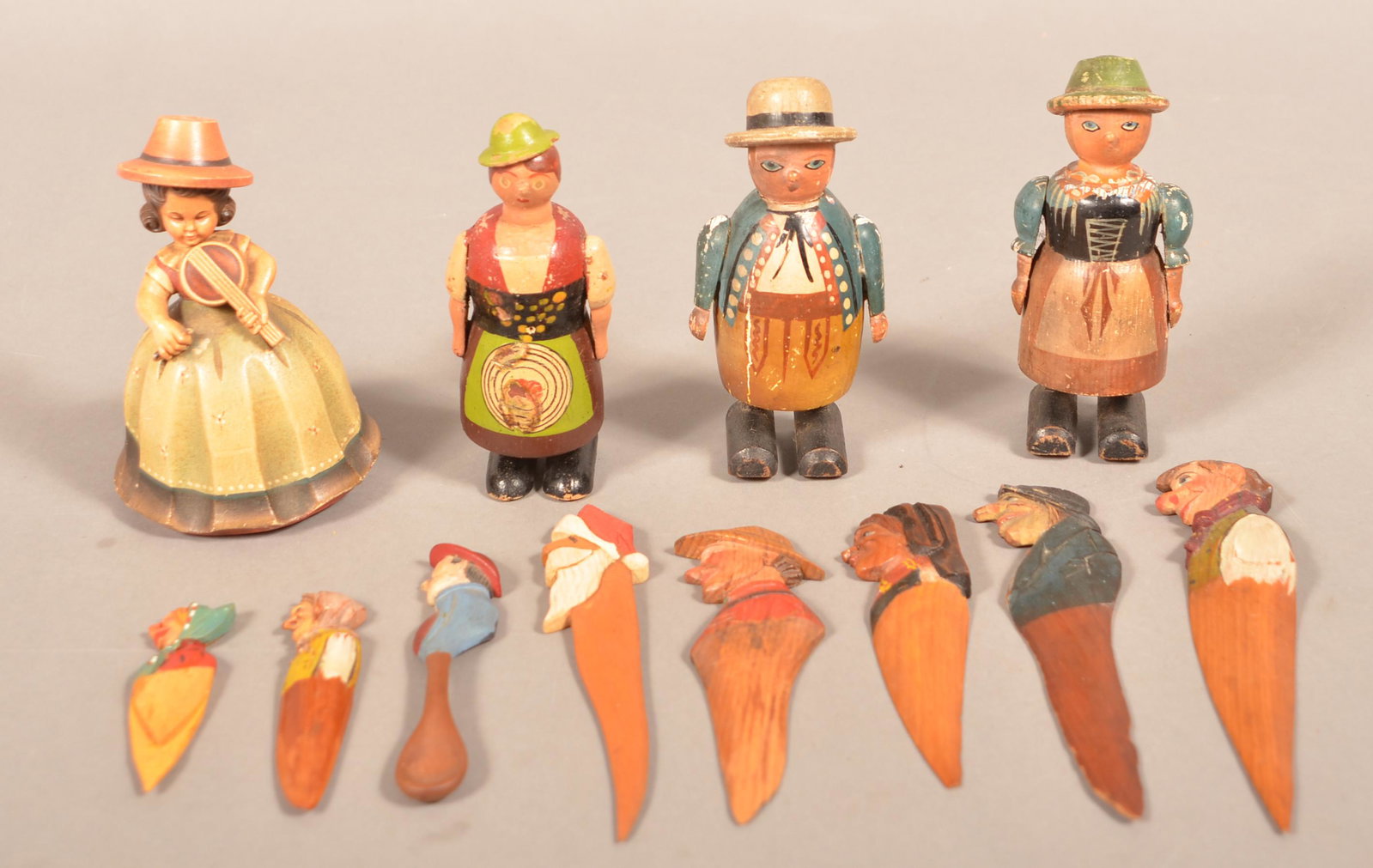 12 Anri Italian Hand-Carved Wood Figural Items.: 12 Anri Italian Hand-Carved Wood Figural Items. Music box, letter openers, bookmarks and spoons. Tallest 5"h. Longest letter opener 7-1/2"l. Condition: Good with minor wear. Music box is not working.