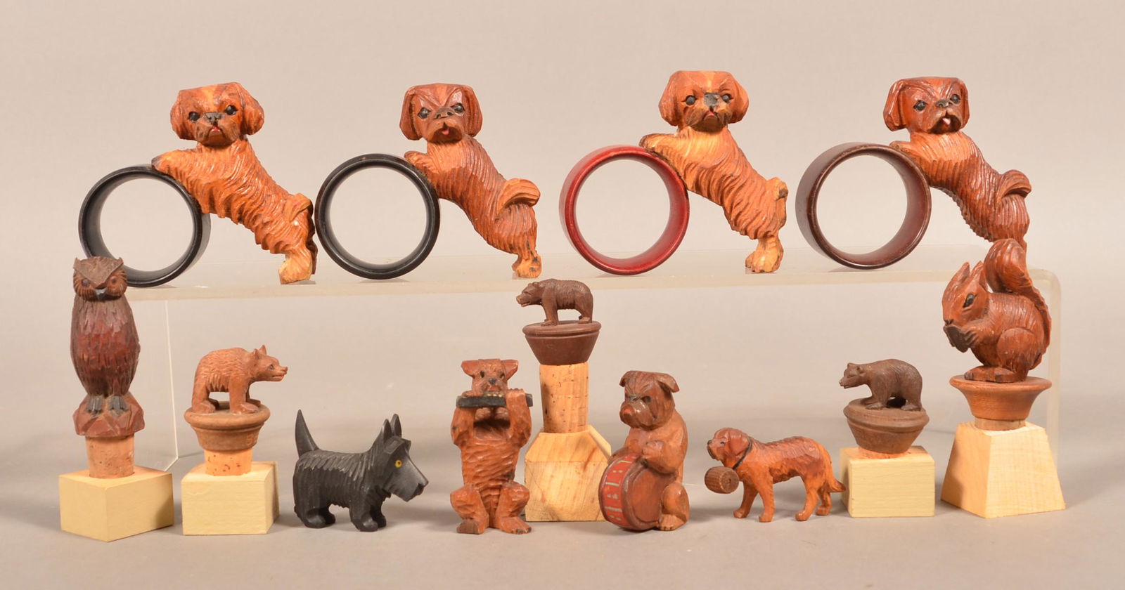 8 Anri and Similar Carved Wood Small Animal Figures.: Eight Anri Italian and Similar Hand-Carved Wood Small Animal Figures. Bottle stoppers, napkin rings, etc. Tallest 4-1/2"h. Condition: Good with minor wear.