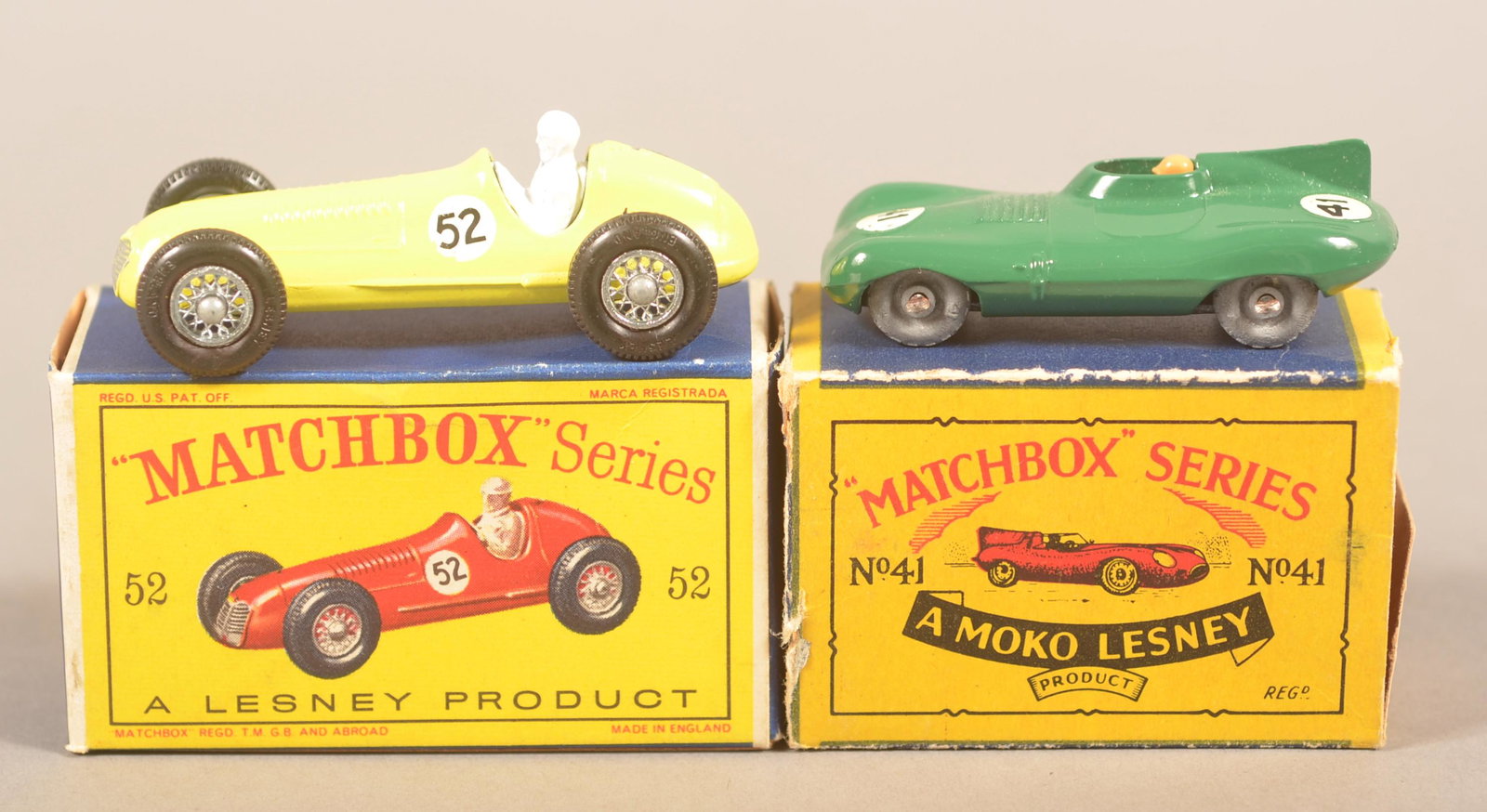 Two Matchbox Die-Cast Race Cars with Boxes.: Two Matchbox Die-Cast Race Cars with Boxes. No. 41, D Type Jaguar and No. 52 Maserati 4CLT 1948. Condition: Good to very good. Loss to 41 box.