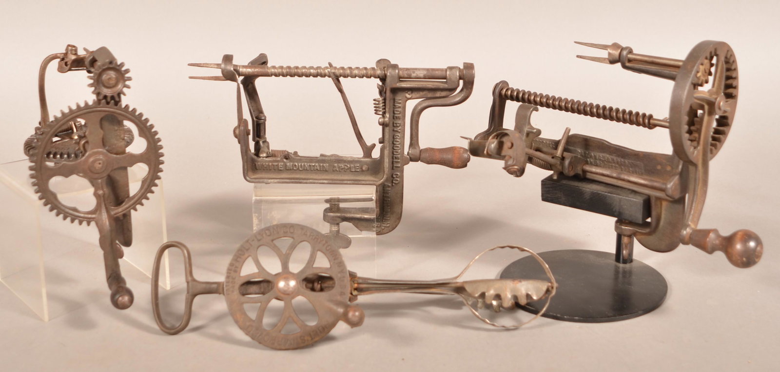Three Antique Cast Metal Apple Peelers and a Mixer.: Three Antique Cast Metal Apple Peelers and a Mixer. Largest apple peeler 7-1/2"h., mixer 12-1/2"h. Condition: Good with use wear.