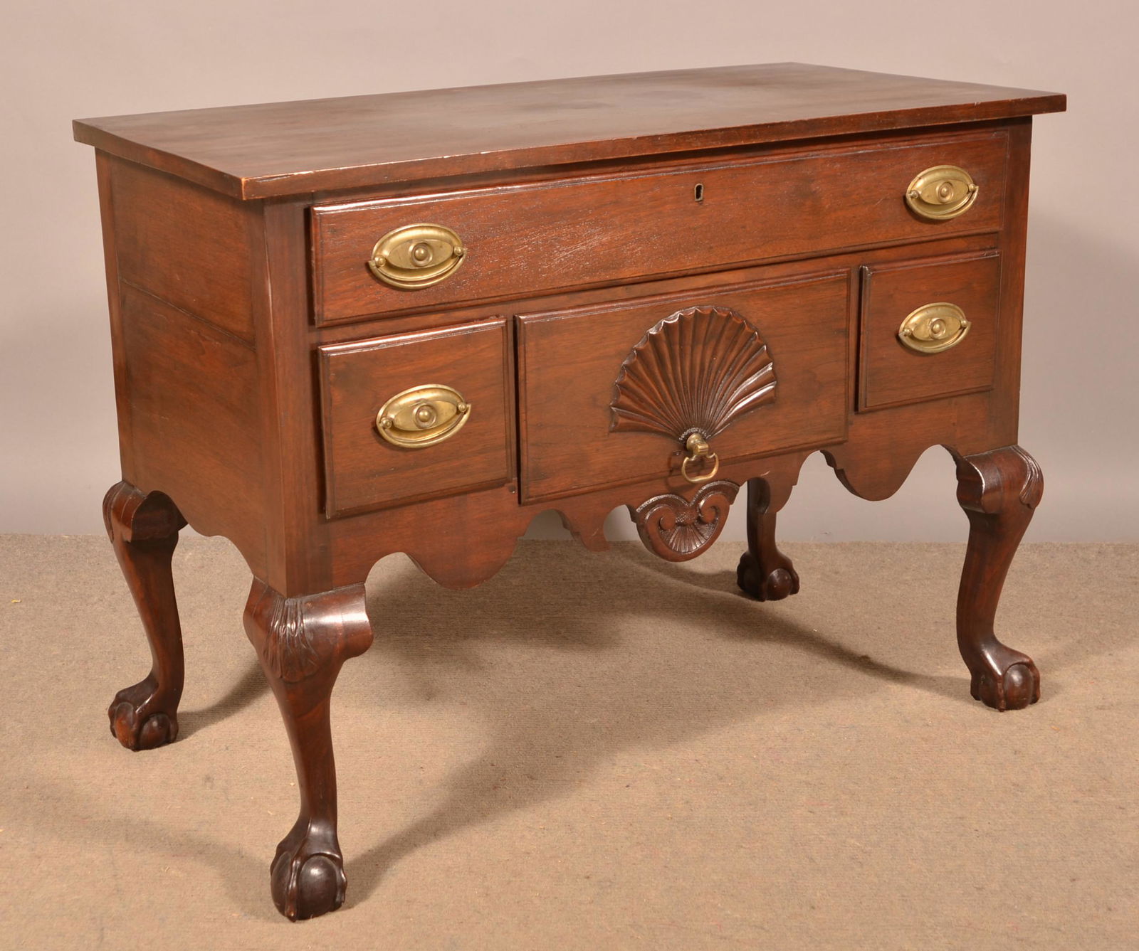 Centennial Chippendale Walnut Lowboy.: Centennial Chippendale Walnut Lowboy. Shell-carved with claw and ball feet. 30"h. x 39"w. x 21"d. Condition: Very good with minor wear.