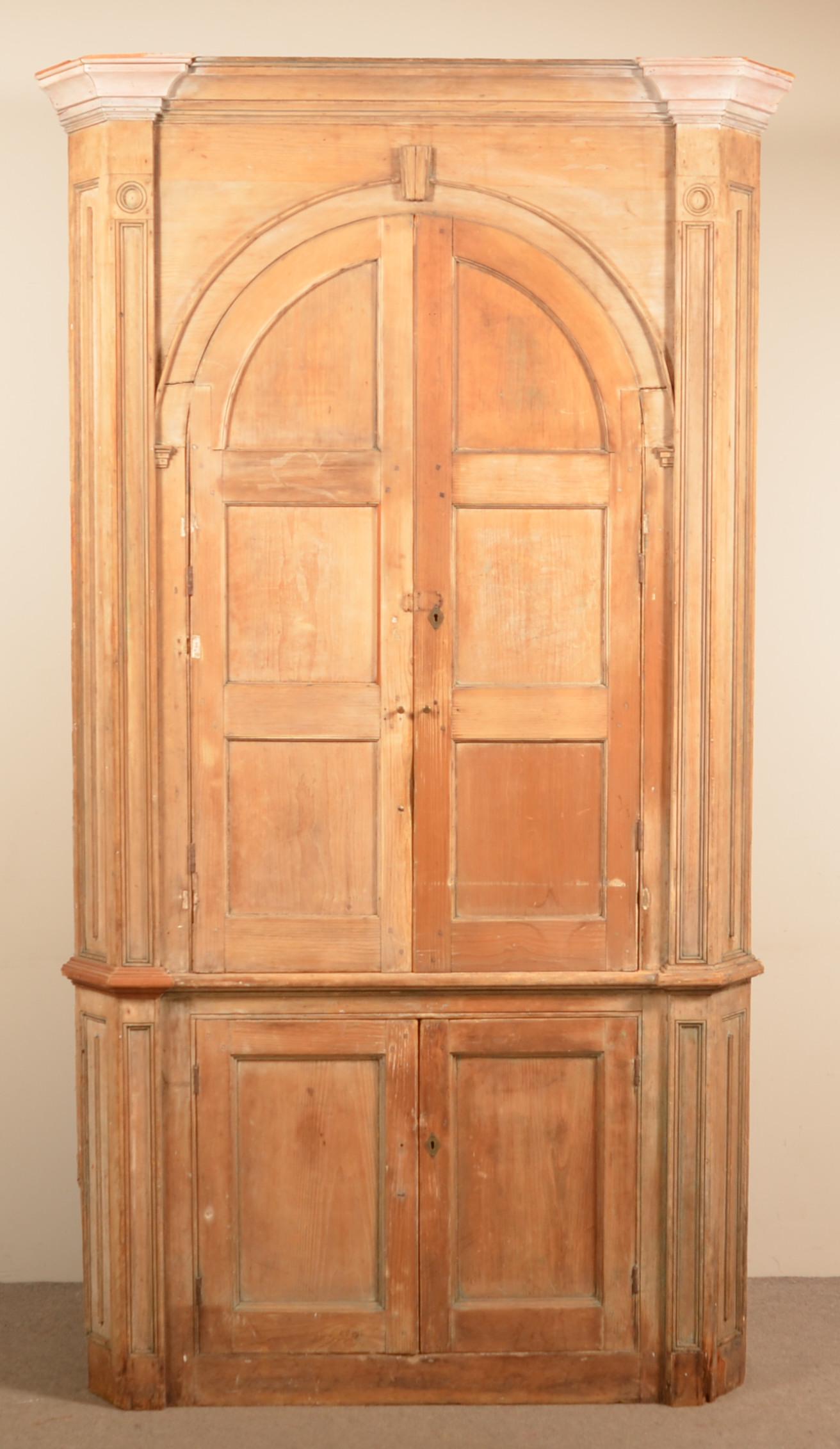 PA Chippendale Architectural Corner Cupboard.: Pennsylvania Chippendale Softwood Architectural Corner Cupboard. Single part, blind door. 93-1/2"h. x 53"w. x 32"d. Condition: Good with wear and repair. Finish removed.