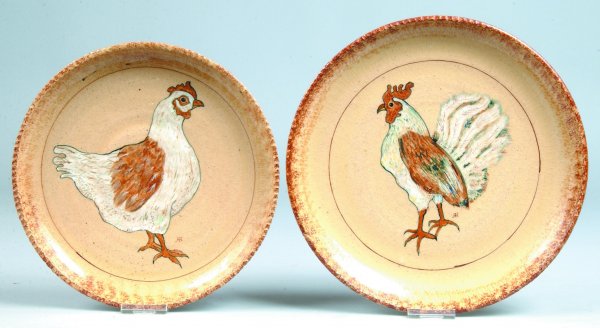 Two Left Handed Russell Henry Pottery Plates, depic: Two Left Handed Russell Henry Pottery Plates, depicting chickens and brown sponged rims, inscribed on bottom Henry's name, "73" etc. on both, 10" and 9"dia., (good).