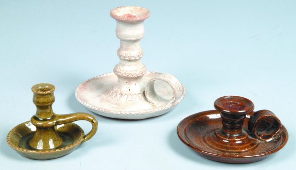 Three Left Handed Russell Henry Pottery Candle Hold: Three Left Handed Russell Henry Pottery Candle Holders, white and brown glazed with foliate and geometric stamped decorations, one green glaze, all inscribed on bottom Henry's name and two '68, '75 da