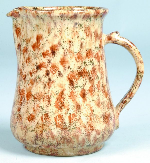 Left Handed Russell Henry Pottery Pitcher, with han: Left Handed Russell Henry Pottery Pitcher, with handle, brown sponged decoration, inscribed on bottom Henry's name and date of '81, etc., 6-1/2"h., (good).