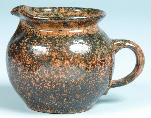Left Handed Russell Henry Pottery Pitcher, bulbous : Left Handed Russell Henry Pottery Pitcher, bulbous form with handle, brown and black sponged decoration, inscribed on bottom Henry's name and date of '68, etc., 4-1/2"h., (good).