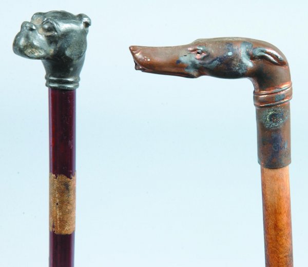 Two Cast Metal Dog Head Form Carnival Canes, one b: Two Cast Metal Dog Head Form Carnival Canes, one bull dog with bamboo shaft and metal ferrule, other copper plated whippet like with wood shaft, both approx. 35"l., (minor wear).