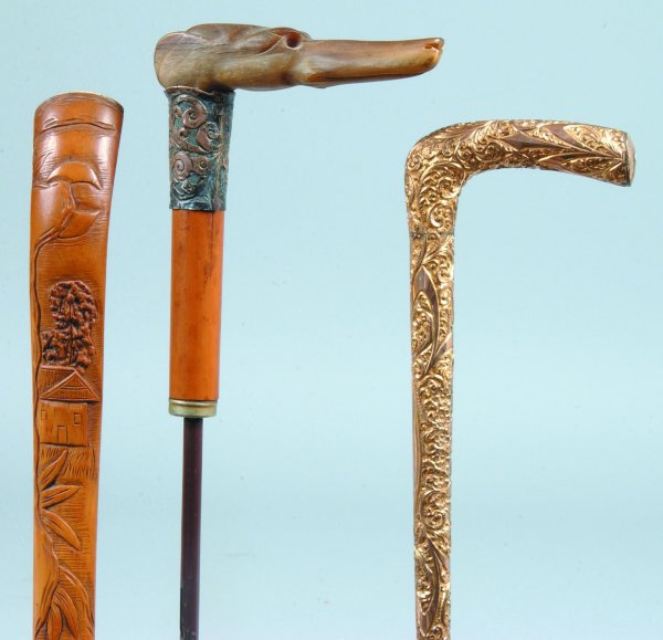 Three Various Parasol Handles, one relief carved d