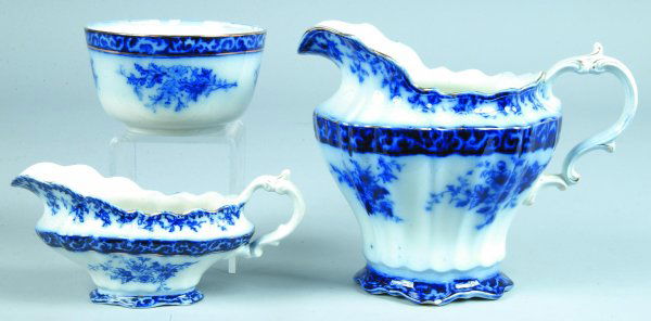 Three Flow Blue "Touraine" Pieces, Water Pitcher,: Three Flow Blue "Touraine" Pieces, Water Pitcher, Waste Bowl and Gravy Boat, printed maker marks, pitcher 8"h., waste bowl 3-1/4"h.x 5-3/4"diam., gravy boat 4"h., (waste bowl and gravy boat in good co