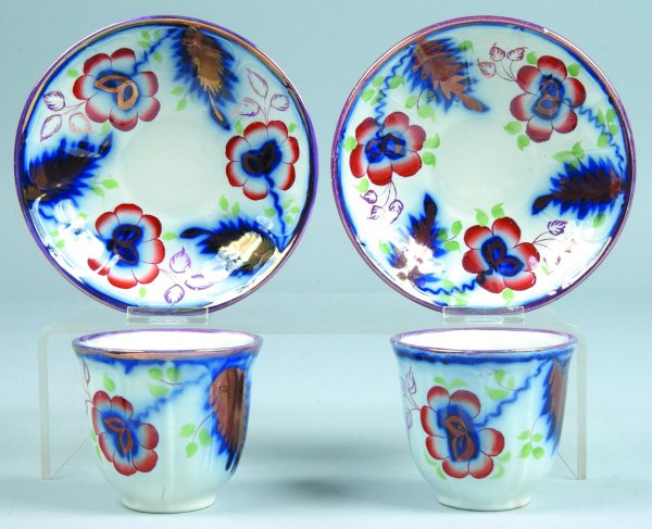 Two Gaudy Ironstone "Floral and Fern" Handleless C: Two Gaudy Ironstone "Floral and Fern" Handleless Cups and Saucers, unmarked, cups 3"h., saucers 5-7/8"diam., (good condition).