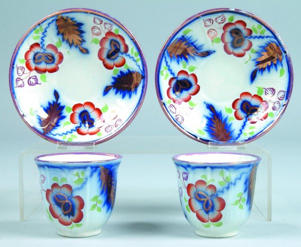 Two Gaudy Ironstone "Floral and Fern" Handleless C: Two Gaudy Ironstone "Floral and Fern" Handleless Cups and Saucers, unmarked, cups 3"h., saucers 5-7/8"diam., (good condition with minor paint loss).