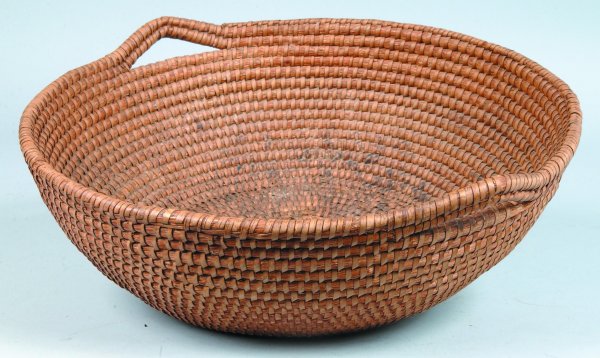 Large Straw Coiled Basket, round form with round b: Large Straw Coiled Basket, round form with round bottom, open weave handles, 6-1/2"h. x 18-1/2"dia., (minor stains).