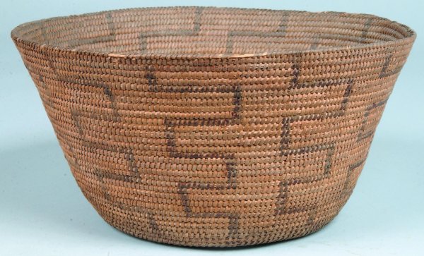 Southwestern Indian Straw Basket, round form with: Southwestern Indian Straw Basket, round form with tapered sides, dark stained woven geometric decoration, 5-3/4"h. x 12"dia., (rim losses).