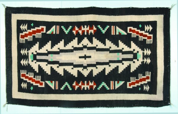 American Indian Loom Woven Wool Rug, white, black: American Indian Loom Woven Wool Rug, white, black, teal, and tan geometric and stylized patterns, 58"l. x 34-1/2"w., (minor edge losses).