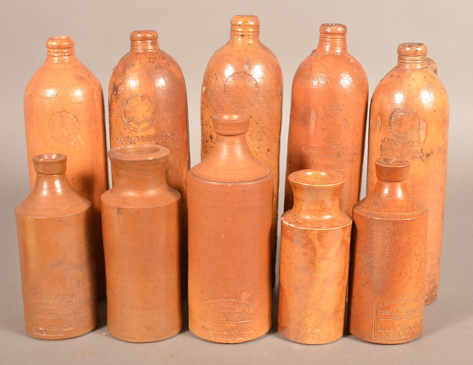 10 Antique English & German Glazed Stoneware Bottles.: 10 Antique English and German Glazed Stoneware Bottles. Various makers. Tallest 12"h. Condition: Good.