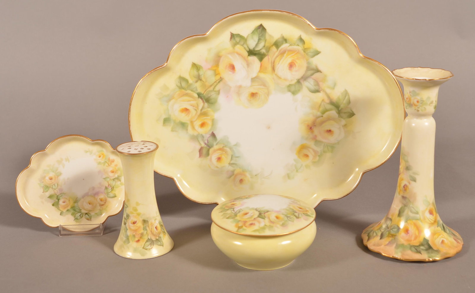 French Limoges Hand-Panted China Dresser Set.: French Limoges Hand-Panted China Dresser Set. Set consisting of: 10" x 12" shaped tray, 7-1/2" candlestick, small tray, covered dresser jar and a hatpin holder. Condition: Very good, hat pin holder ha