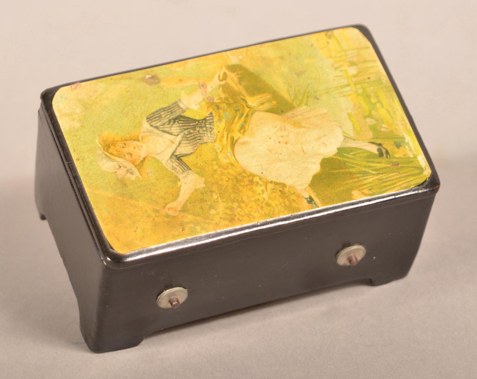 Swiss 19th Century Miniature Cylinder Music Box.: Swiss 19th Century Miniature Two Tune Cylinder Music Box. Black lacquered case with applied transfer on lid. 2"h. x 4"w. x 2-1/2"d. Condition: Very good with use wear.