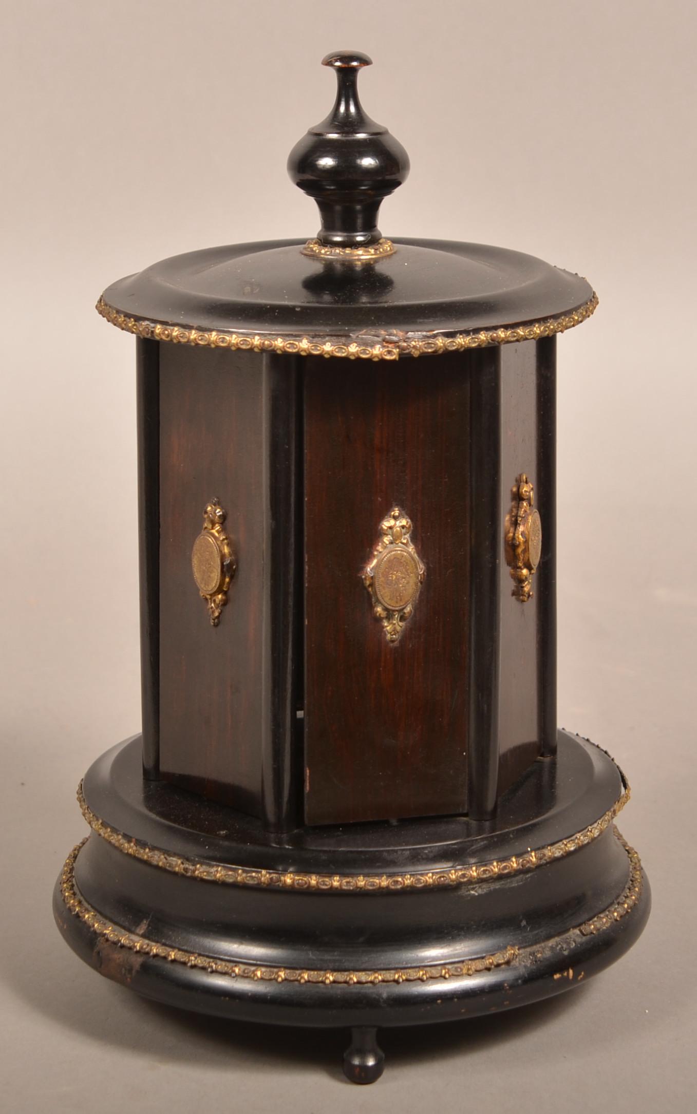 Vintage Musical Cigar Dispenser Carousel.: Vintage Musical Cigar Dispenser Carousel. Ormolu mounted lacquered rosewood case. 11-3/4"h. Condition: Good with minor wear and loss.