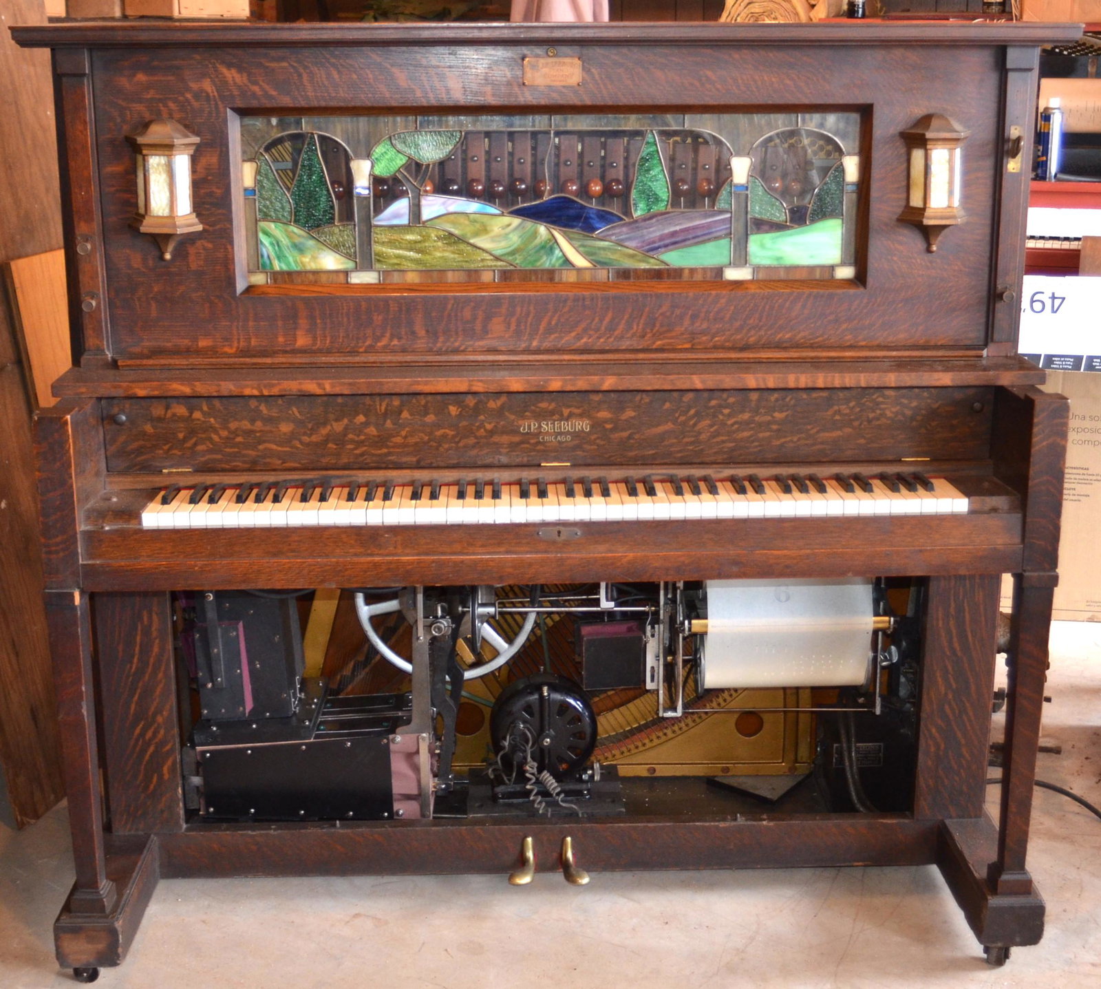 J.P Seeburg Oak Upright Coin Op Player Piano.: J.P Seeburg Oak Upright Coin Op Player Piano. SN156902, Lead Glass Scenic Tablet, 58"h.x60"w.x31"d. Condition: Working, Good-Very Good with wear.