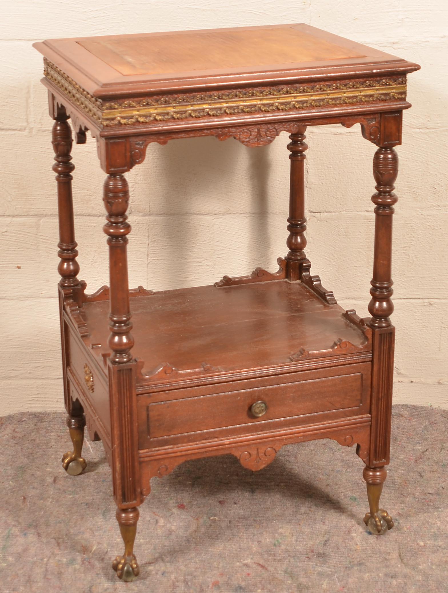 American Victorian Walnut Music Box Stand.: American Victorian Walnut Music Box Stand. Carved and molded with ormolu mounted skirt and metal claw and glass ball feet. 38-1/2"h. x 21"w. x 24"d. Condition: Very good with minor wear.