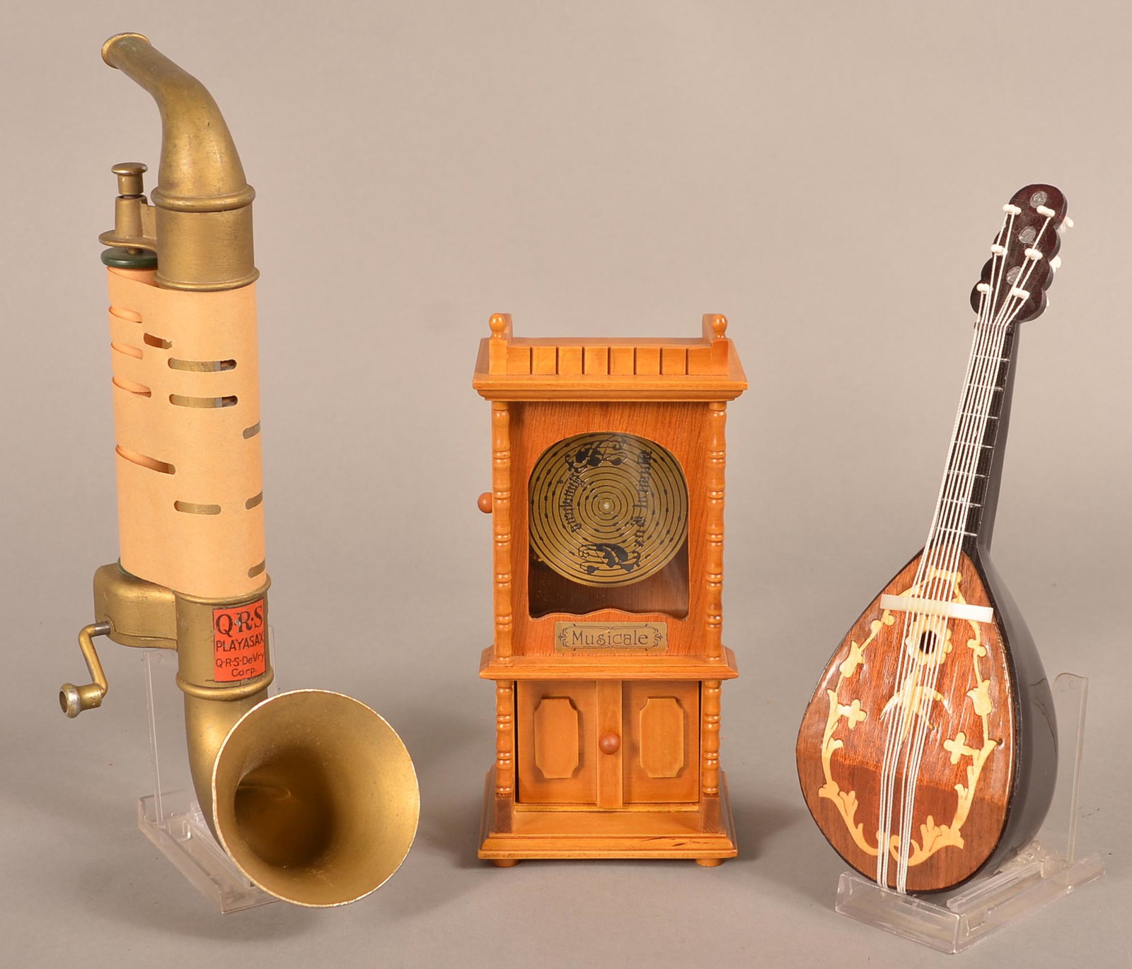 Three Various Music Boxes/ Toy Playasax.: Three Various Music Boxes/ Toy Playasax, 11"l. Condition: Good with use wear.