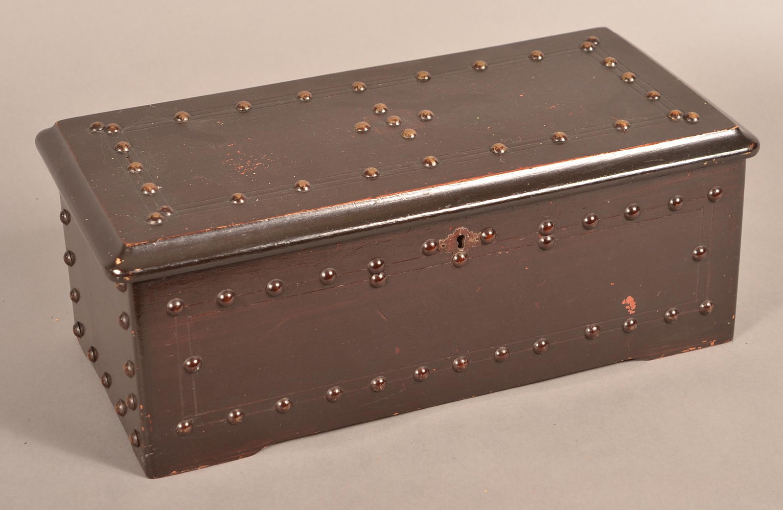 Swiss 19th Century Cylinder Music Box.: Swiss 19th Century Cylinder Music Box. Lacquered case with brass tack decoration. Penny Operated Machine. 5-3/4"h. x 15-1/2"w. x 7"d. Condition: Good with use wear.