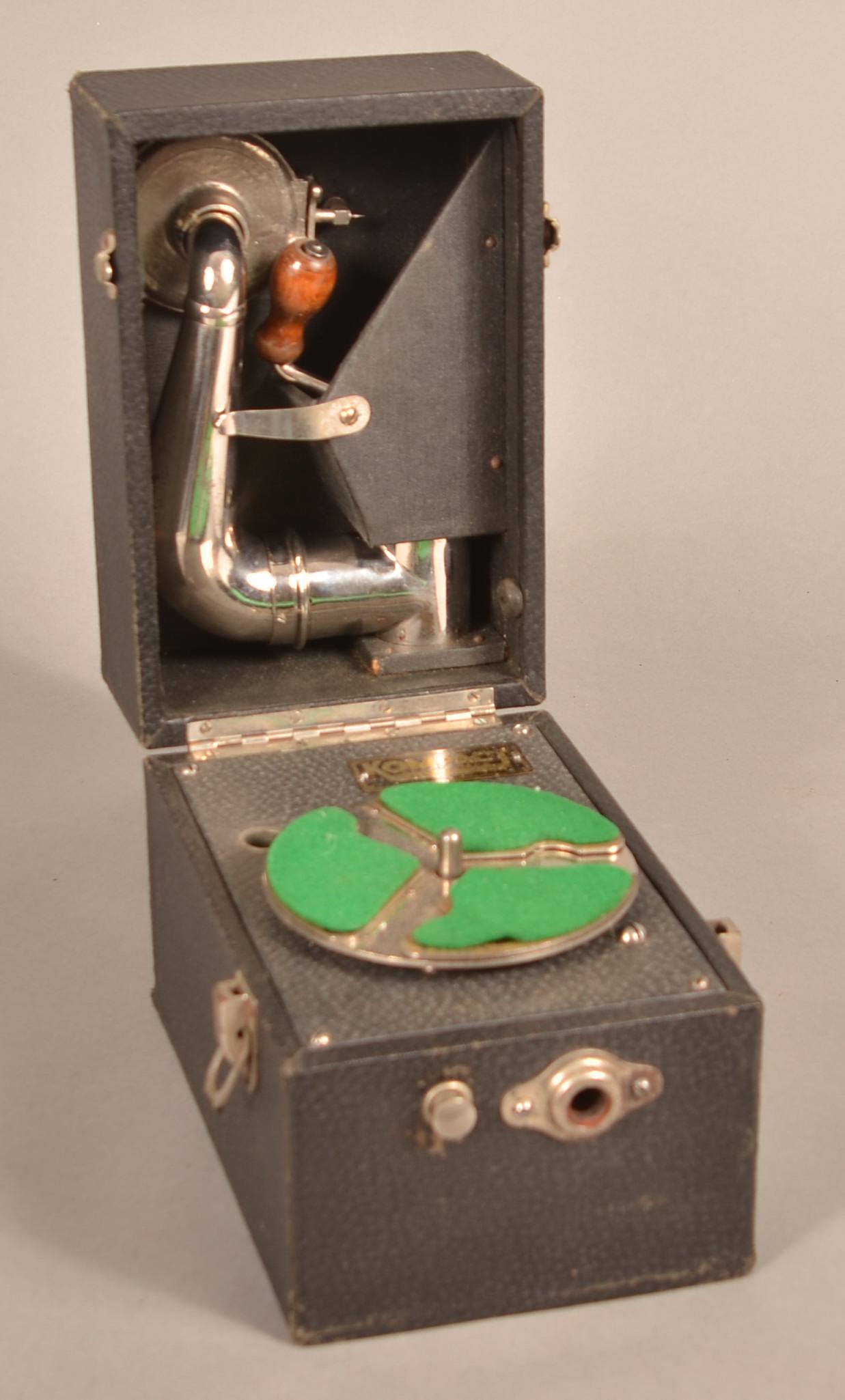 Vintage Kompact Portable Wind-Up Record Player.: Vintage Kompact Portable Wind-Up Record Player. Made by Plaza Music Company, New York. 6"h. x 8"w. x 5-1/4"d. Condition: Good with use wear.