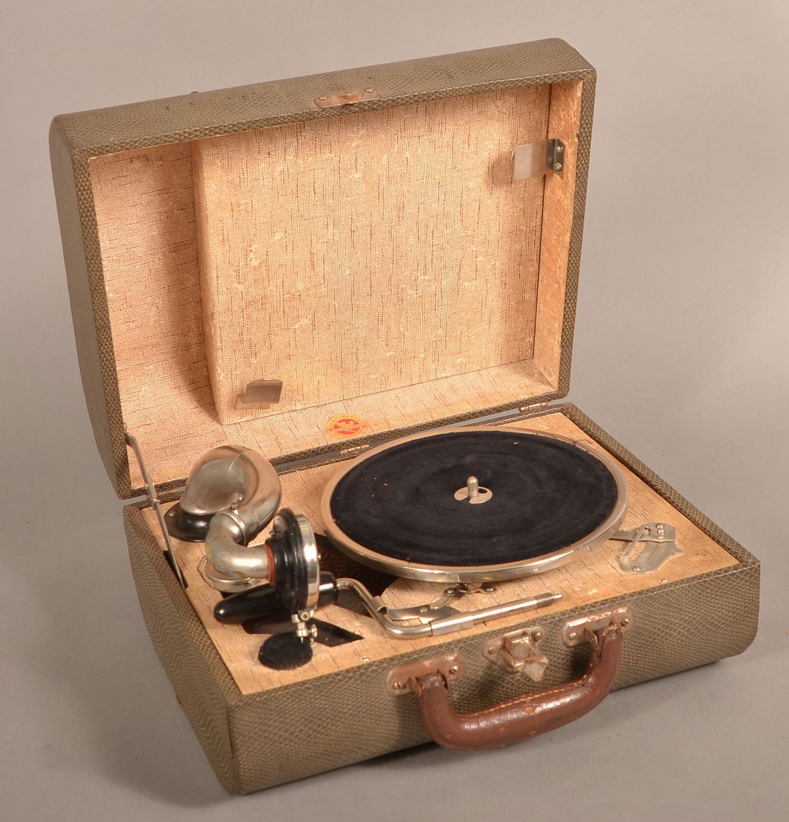 Vintage Continental Portable Suitcase Record Player.: Vintage Continental Portable Suitcase Record Player. Wind-up mechanism with faux snakeskin case. 7" x 13-3/4" x 10-1/2". Condition: Good with use wear.