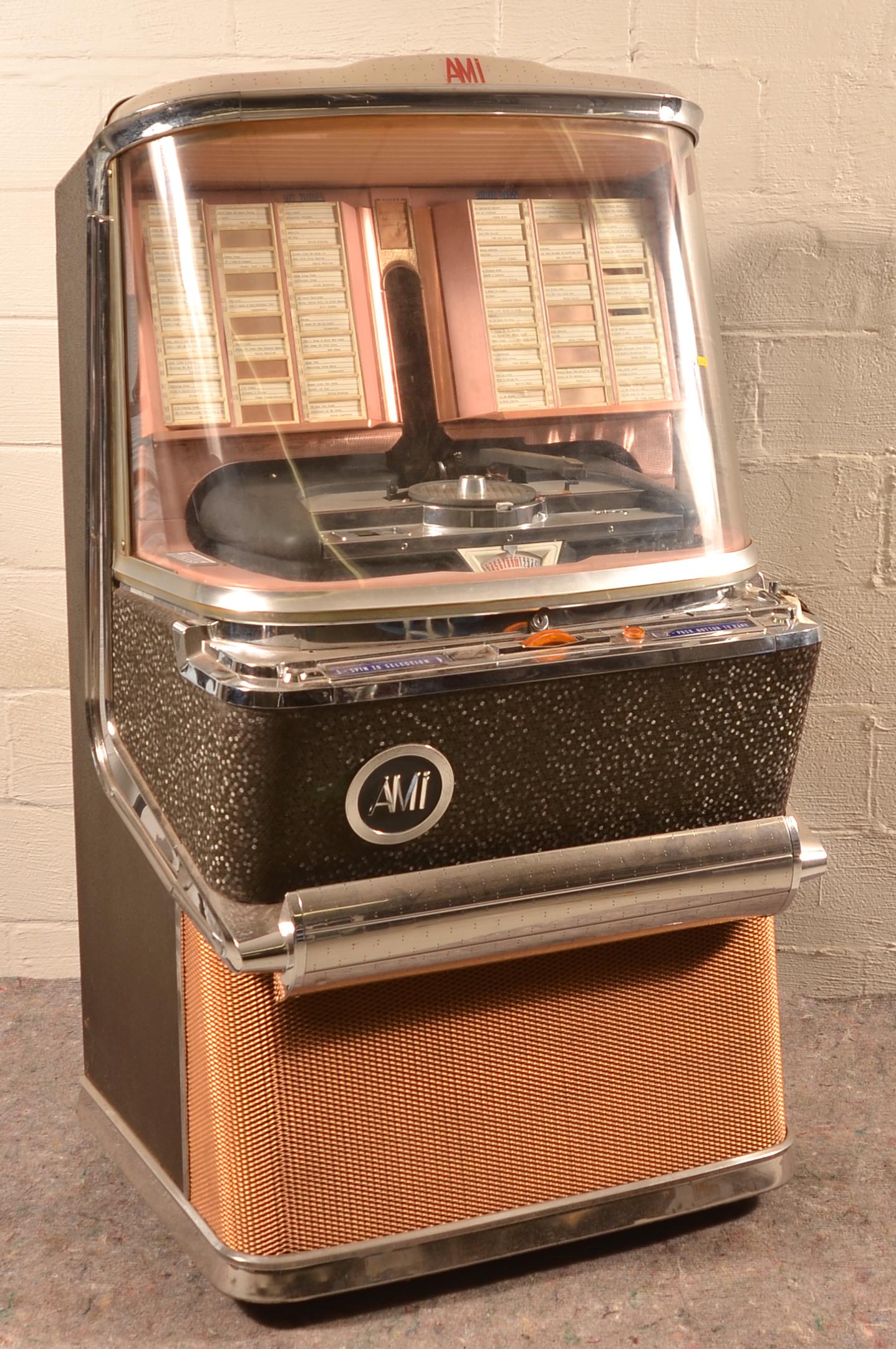 Ami Art Deco Style H-100 Jukebox.: Ami Art Deco Style H-100 Jukebox. Circa 1957. Restored/repaired by Bob Burke, Media, PA in 2014. 60"h. x 33"w. x 28"d. Condition: Good with wear.