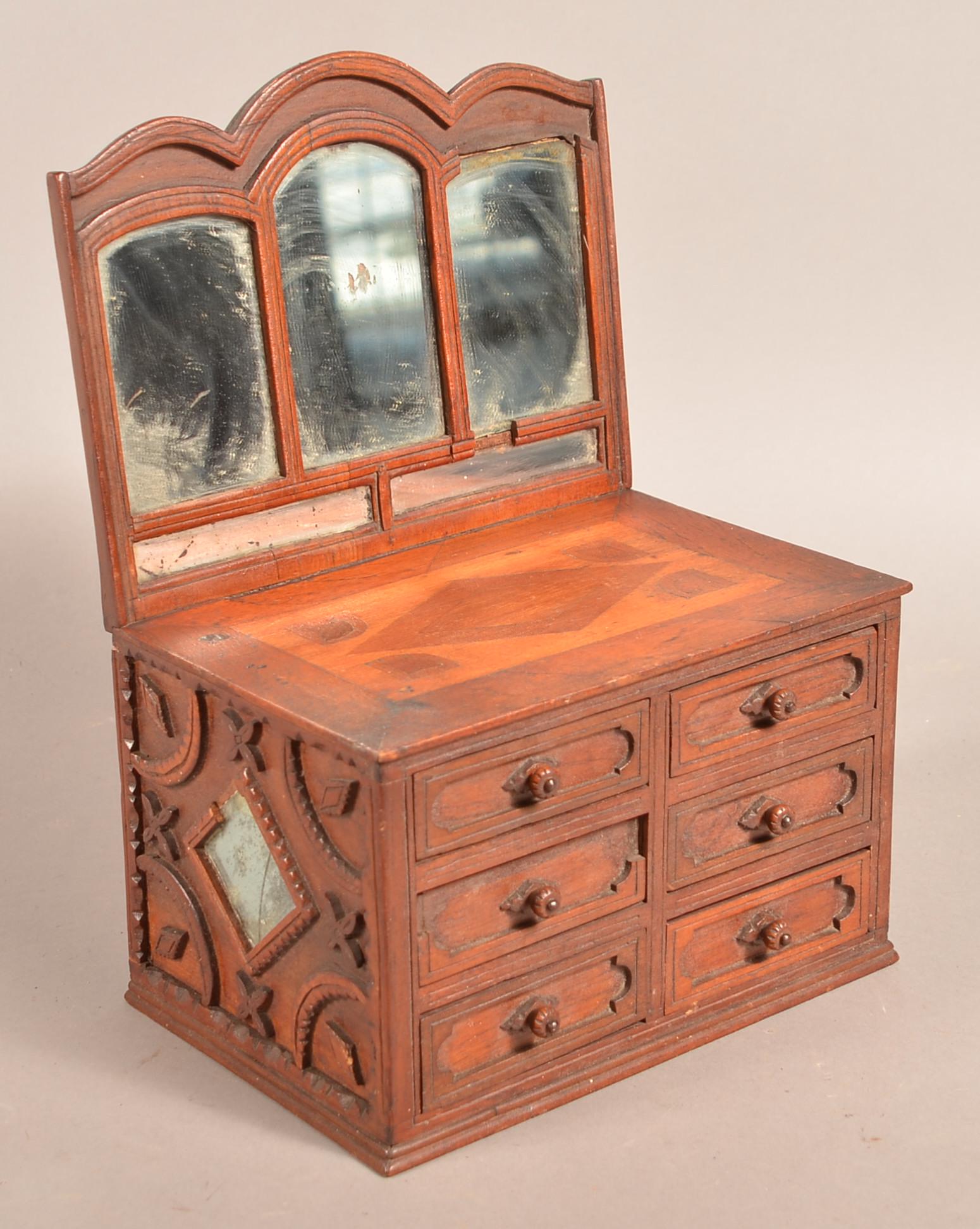 Antique Tramp Art Miniature Bureau.: Antique Tramp Art Miniature Bureau. Mirror-back with inlaid top, six drawers and mirrored sides with applied floral and geometric designs. 13"h. x 9-1/2"w. x 6-1/2"d. Condition: Fair to good with wear