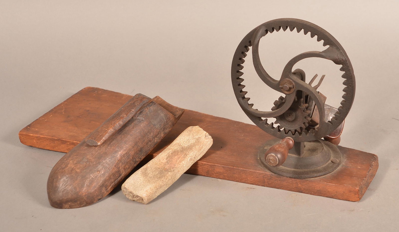 19th Century Wooden Apple Peeler.: 19th Century Wooden Apple Peeler. Crank action with cast metal gears and wood plank base. 21"l. overall. Condition: Good with use wear.