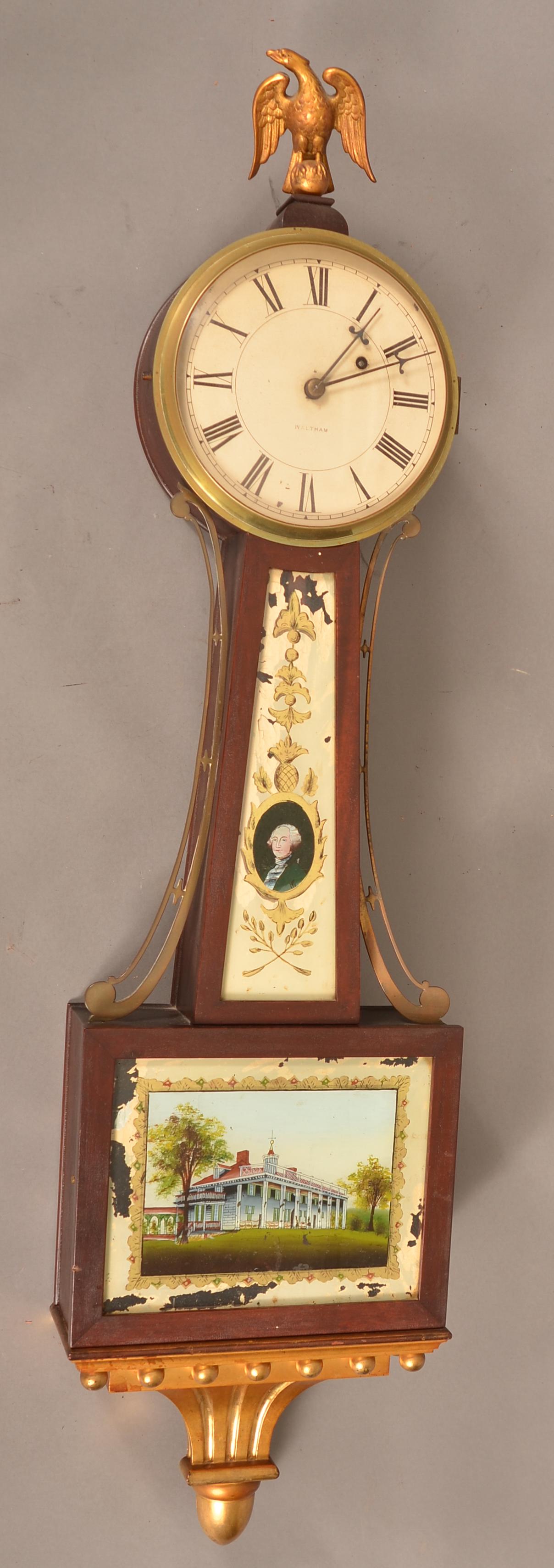 Waltham Banjo Clock with Mt. Vernon Decoration.: Waltham Banjo Clock with Washington & Mt. Vernon Decoration. mahogany case of typical form maintaining original reverse painted bust of George Washington and Mt. Vernon eglomise painted tablets. Brass