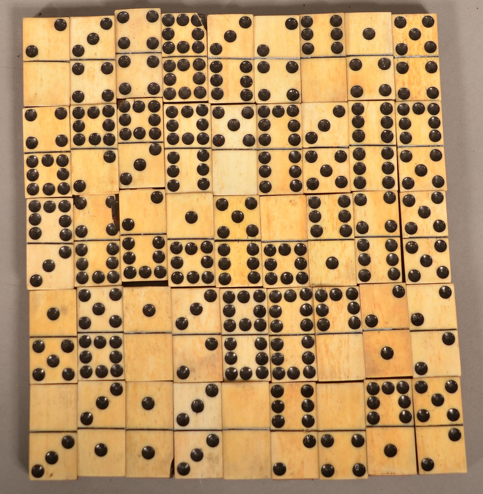 Antique Set of 45 Wood-backed Dominoes.: Antique Set of 45 Wood-backed Dominoes. Set of 45 piano key style dominoes. 19th century. 1-5/8” x 3/4” x 3/8” tall. Condition: Very good.