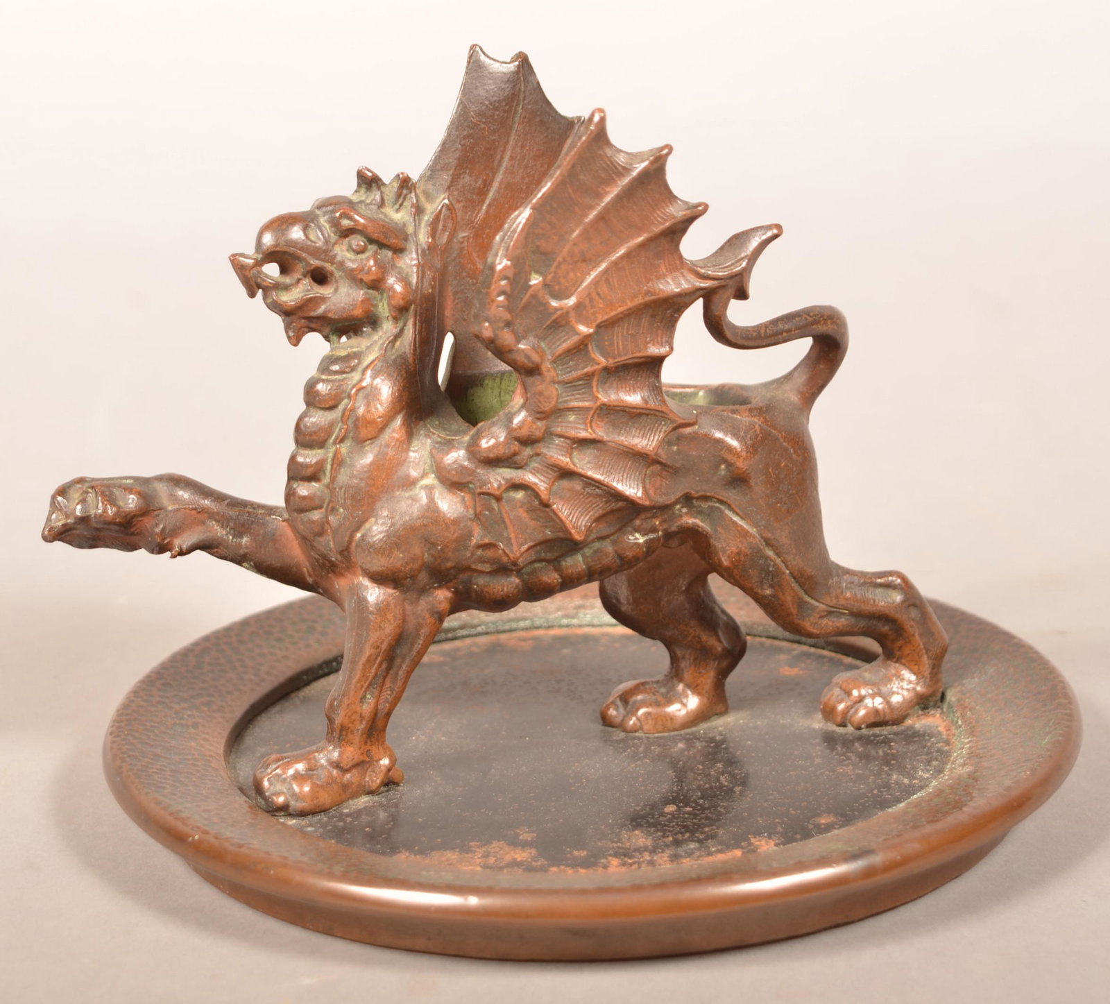 Vintage Bronze Finished Cast Iron Gryphon Ashtray.: Vintage Bronze Finished Cast Iron Gryphon Ashtray with Matchbox Holder. Labeled "E & M" trade mark. 6"h. x 8" diam. Condition: Good with scattered rust on tray.