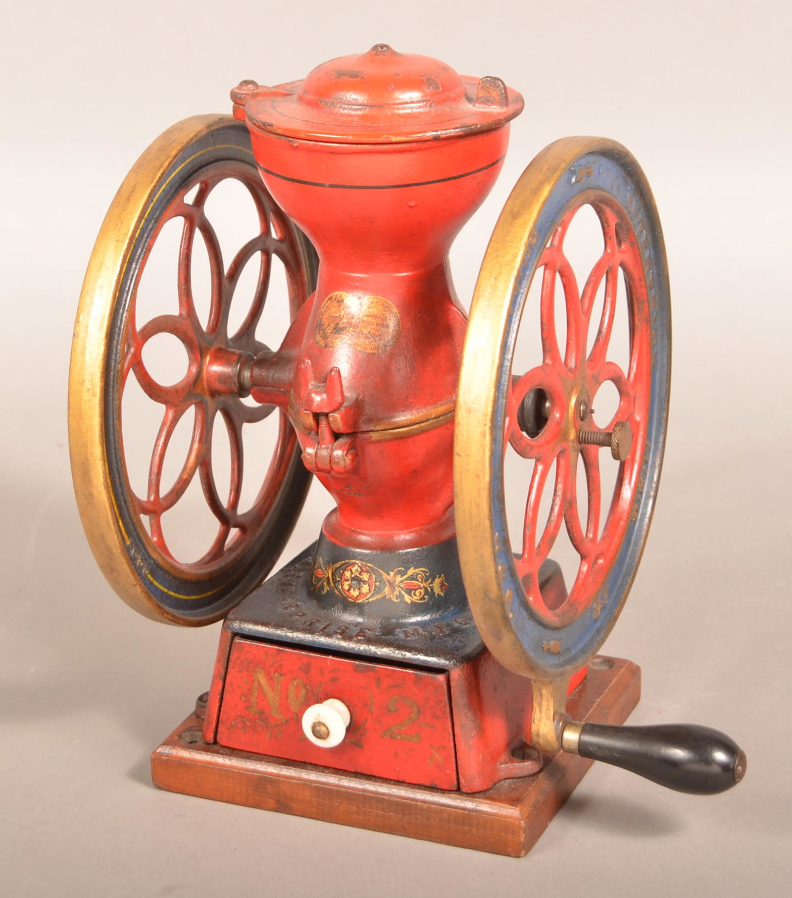 19th Century Enterprise No. 2 Cast Iron Coffee Mill.: 19th Century Enterprise No. 2 Cast Iron Coffee Mill. Double wheel with wooden handle and metal drawer. 12 1/2"h. Condition: Very good with use wear.