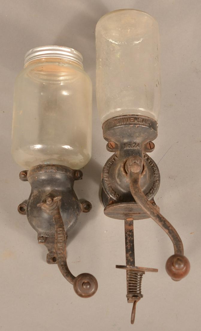 Two Antique Cast Metal Wall-Mount Coffee Mills.: Two Antique Cast Metal Wall-Mount Coffee Mills. Tallest 9-1/2"h. Condition: Good with use wear.