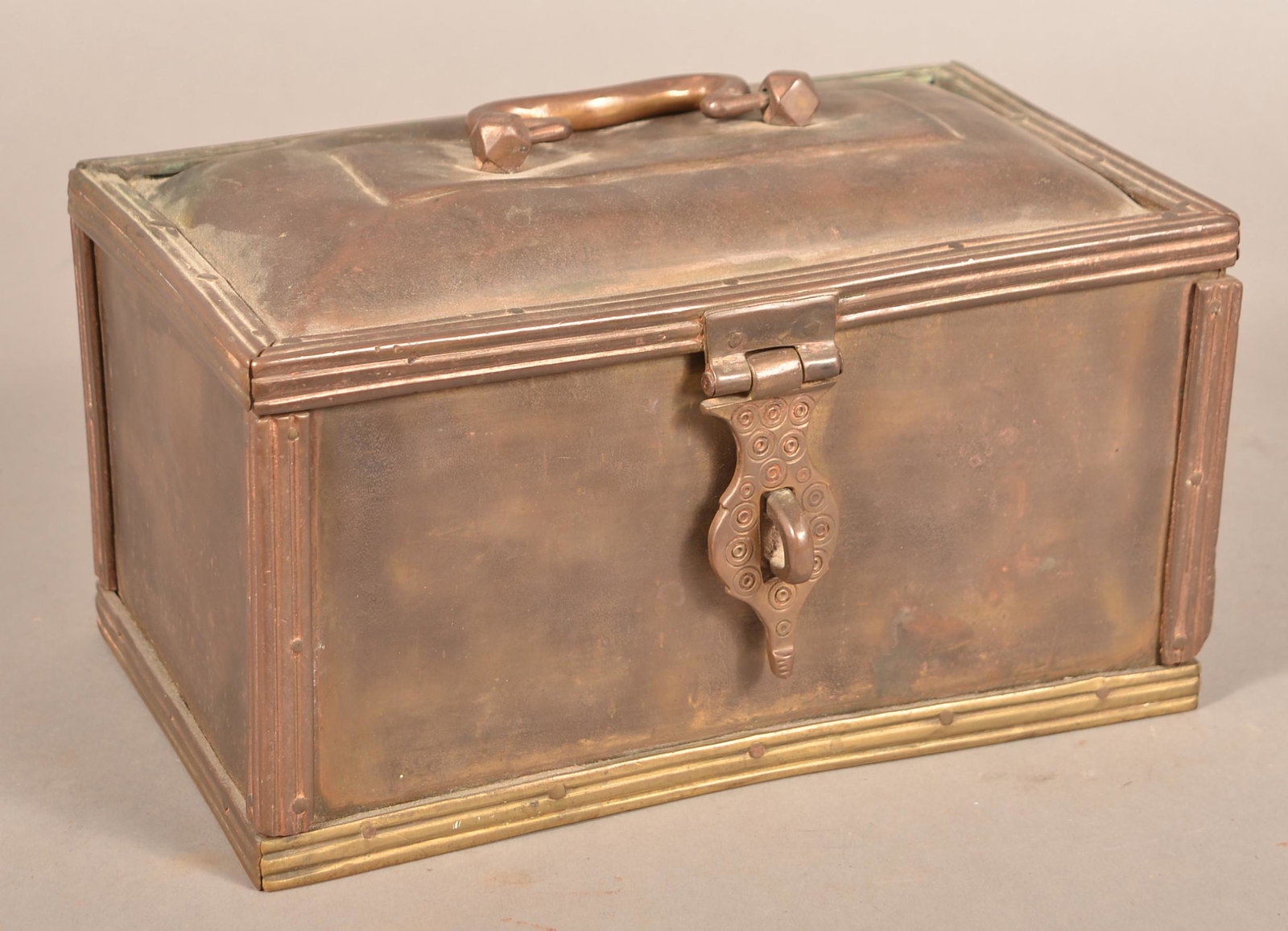 Antique Iron Lockbox with Brass Trim.: Antique Iron Lockbox with Brass Trim. Punch decorated hasp. 6"h. x 11"w. x 7"d. Condition: Good with some dents and wear.