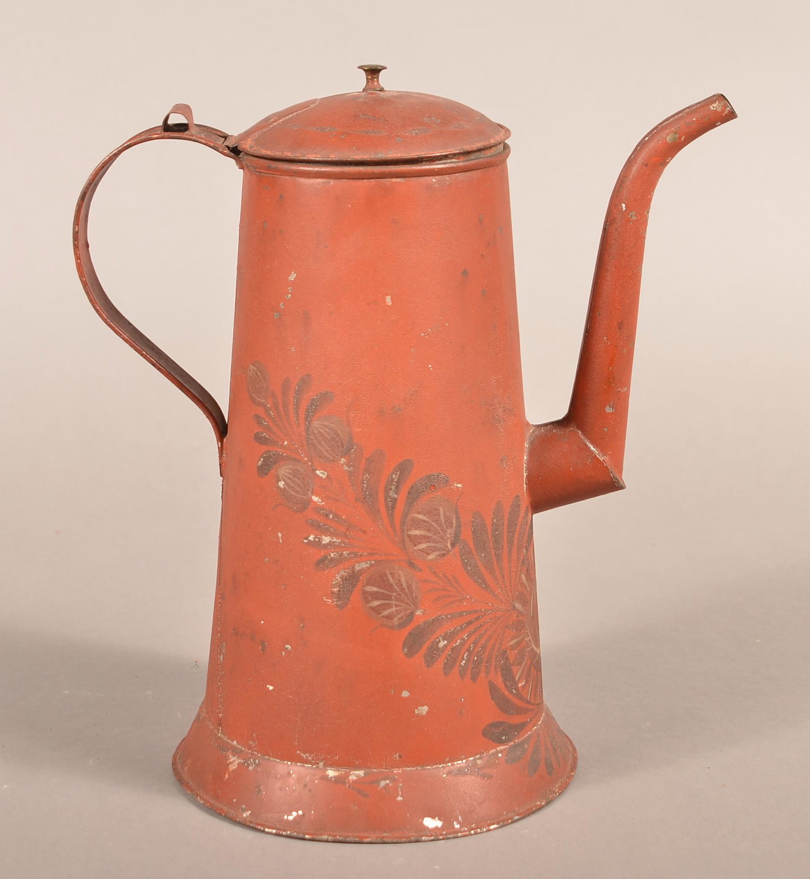 Pennsylvania 19th Century Red Toleware Coffee Pot.: Pennsylvania 19th Century Red Toleware Coffee Pot. Lighthouse form, dome lid with brass mushroom finial, goose neck spout, reinforced C-scroll handle, tapered body and molded base rim. Ex Skinner. 10-