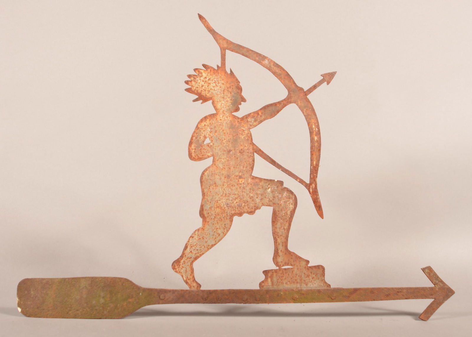 Sheet Iron Indian Silhouette Weathervane.: 19th Century Sheet Iron American Indian with Bow and Arrow Silhouette Weathervane. 21"h. x 30-1/2"w. Condition: Good with even pitting and rust, remnants of original paint.
