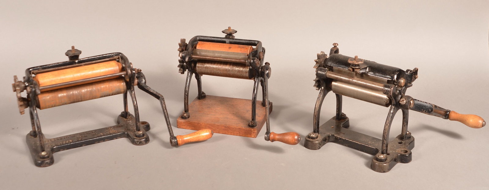 Three Various Antique Cast Metal Pasta Rollers.: Three Various Antique Cast Metal Pasta Rollers. 7-1/2" to 14"w. overall. Condition: Good with scattered rust and use wear.