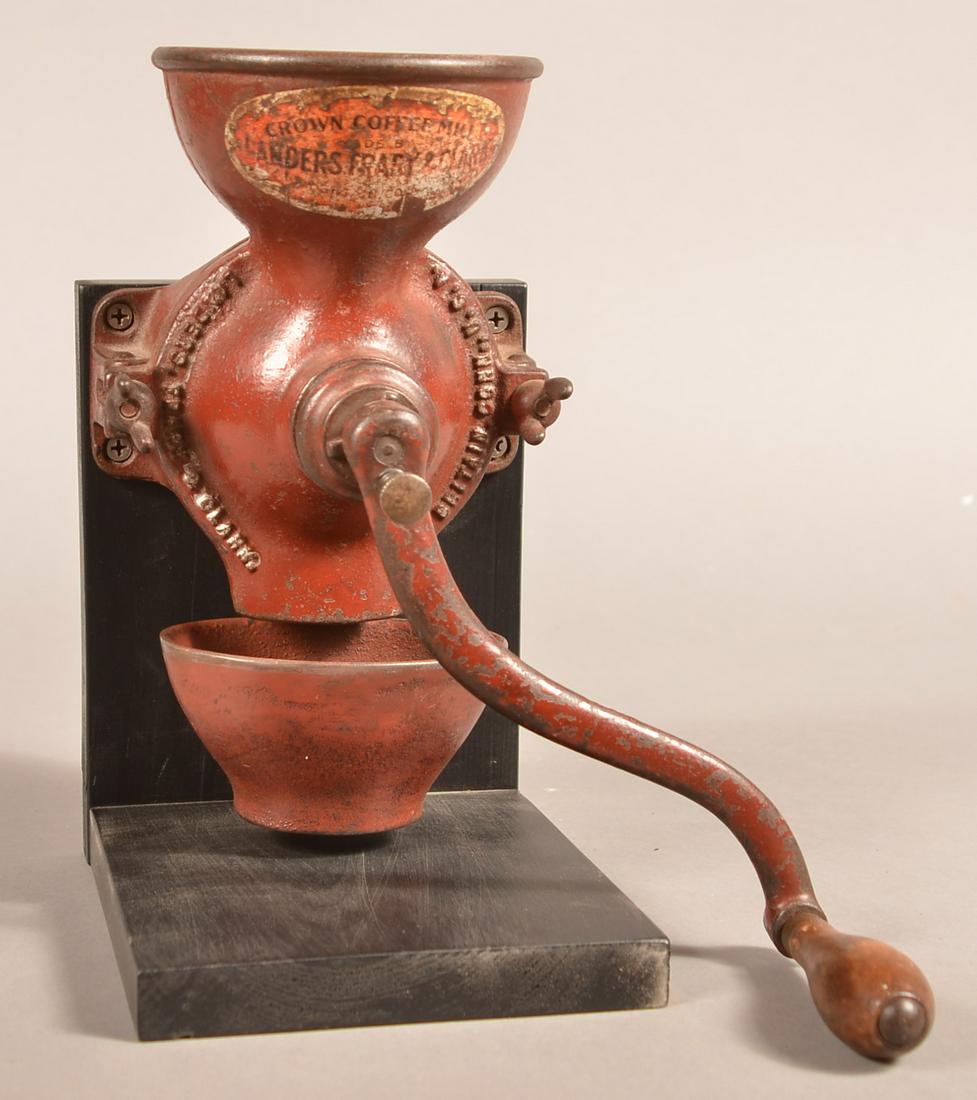 Antique Cast Iron Wall Mount Model Crown Coffee Mill.: Antique Cast Iron Crown Coffee Mill by Landers, Frary & Clark. New Britain Connecticut. Wall mount Model # 001. Original decals and red paint. 9-3/4"h. Condition: Good with use wear.