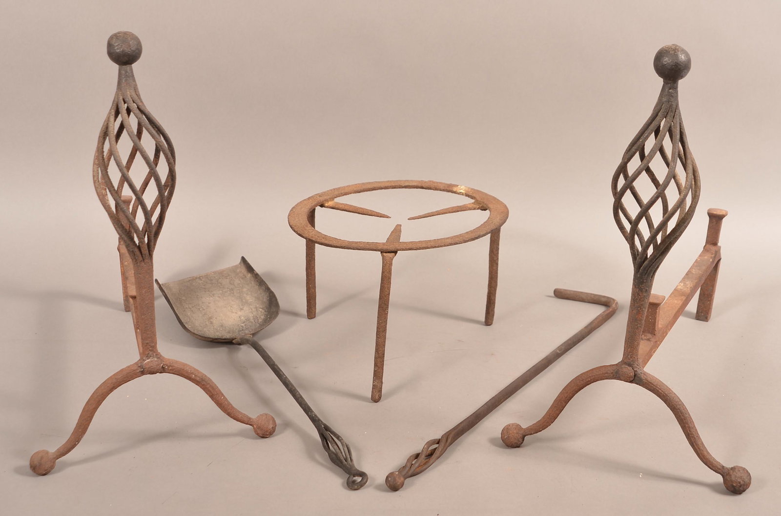 Lot of Antique Iron Hearth Equipment.: Lot of Antique Iron Hearth Equipment. Pair of andirons, two hearth tools and a trivet. Andirons 18"h. Condition: Fair to good with rust, pitting and wear.