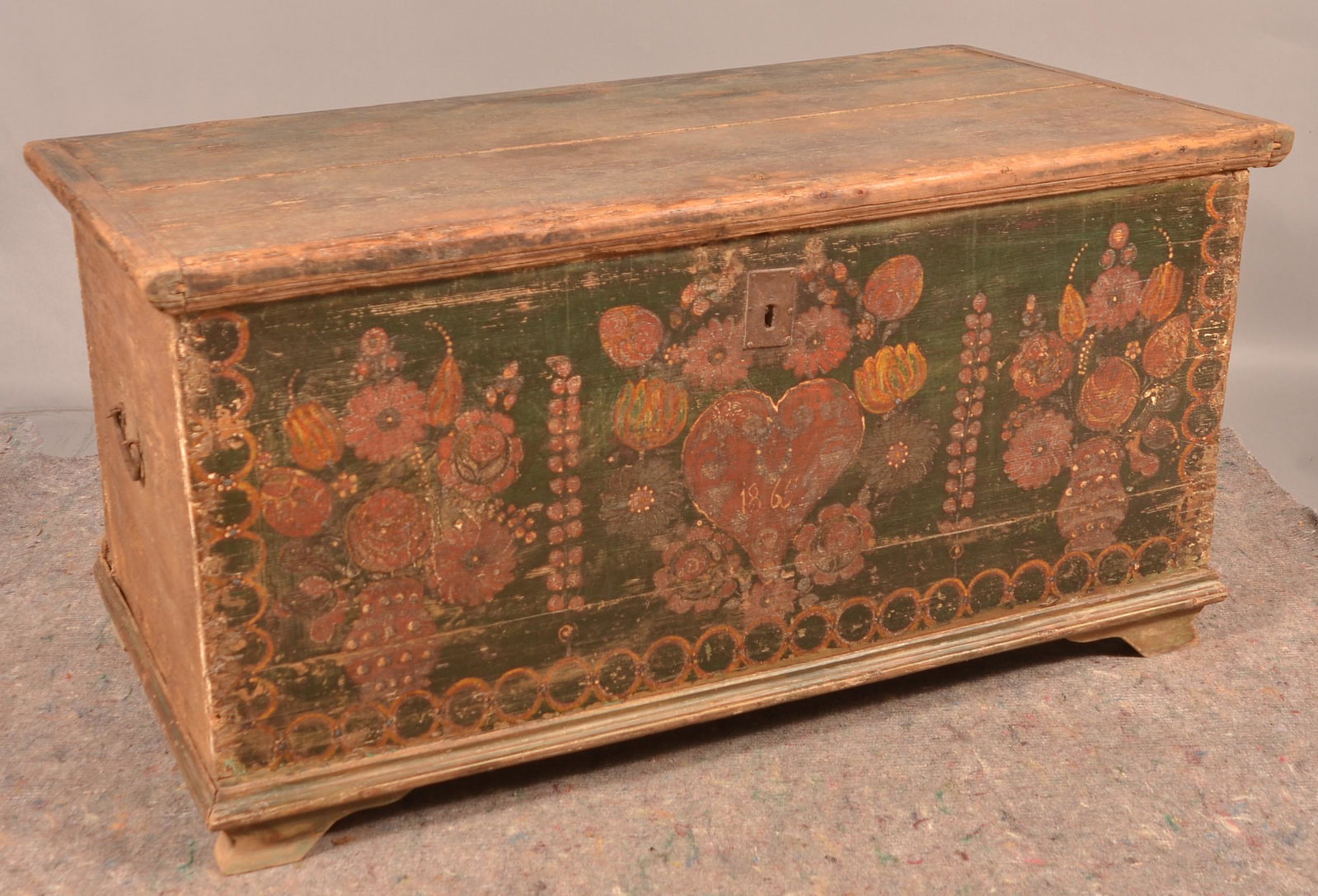 Continental Painted Softwood Blanket Chest.: Continental Painted Softwood Blanket Chest. Dated 1865 with the original polychrome heart, floral and foliate decoration. Condition: Good with wear and loss.