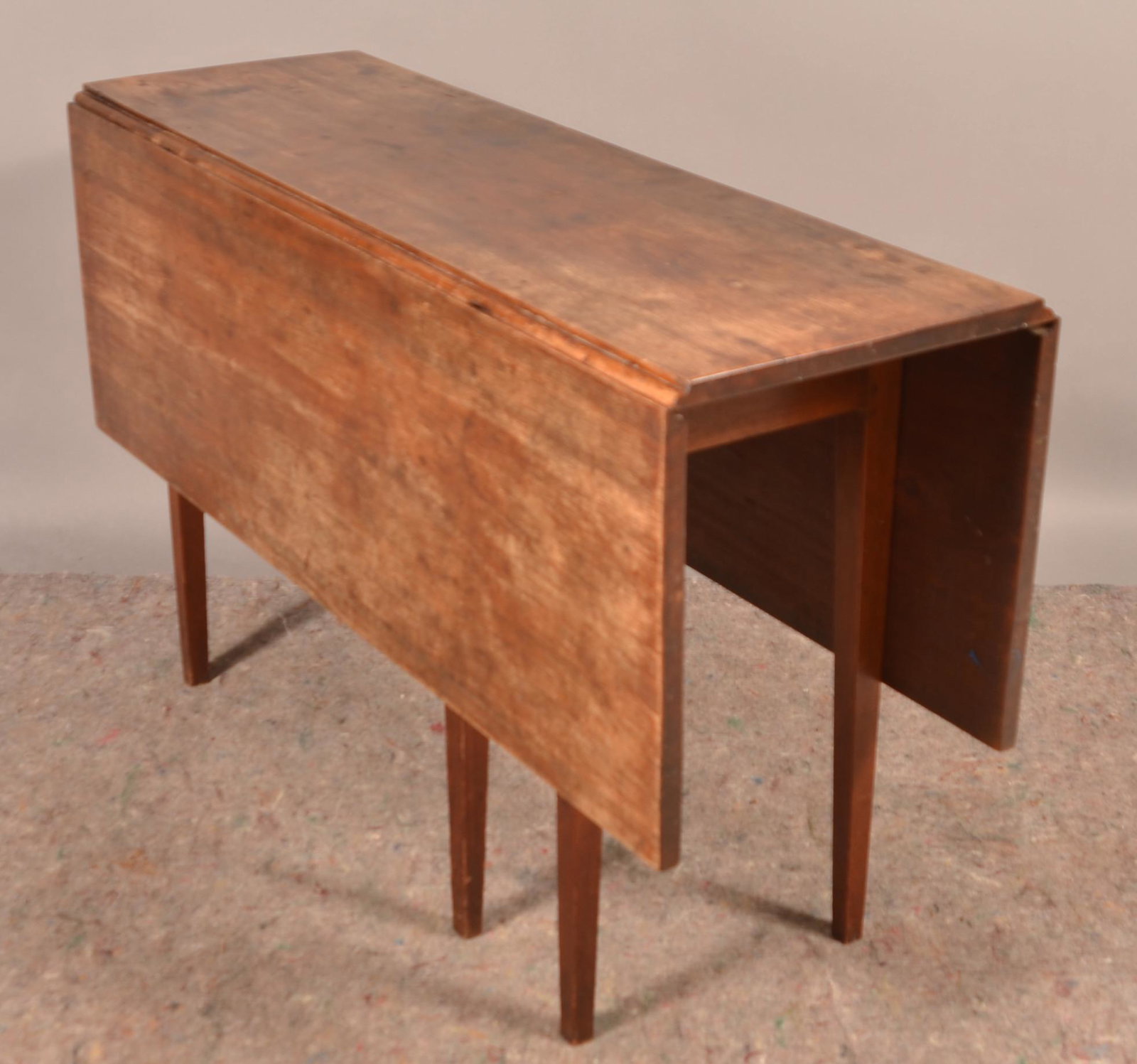 American Hepplewhite Walnut Gate Leg Drop Leaf Table.: American Hepplewhite Walnut Gate Leg Drop Leaf Table. 29-1/2"h. x 16-3/4"w. x 49"l. Condition: Good with wear.