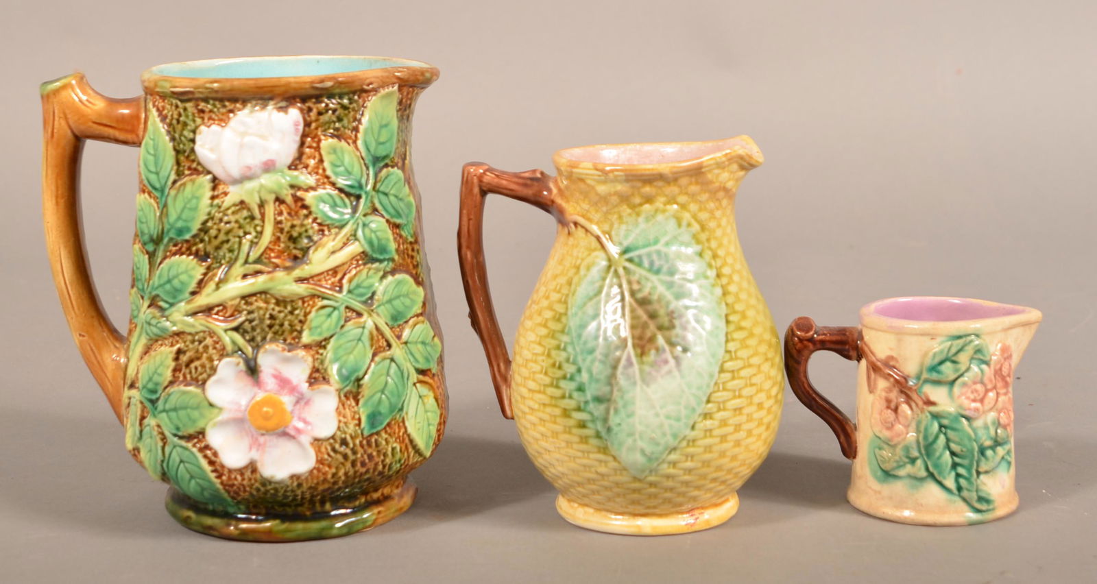 Three Majolica Pottery Pitchers. (1 of 4)
